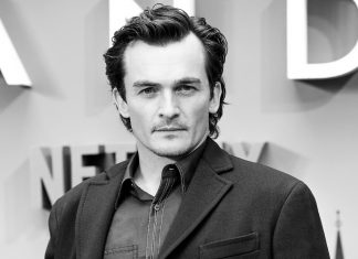 Rupert Friend se alătură lui John Malkovich în distribuția filmului Cravata Galbenă